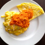 Polenta with fresh corn, carrots and zucchini with a fried egg