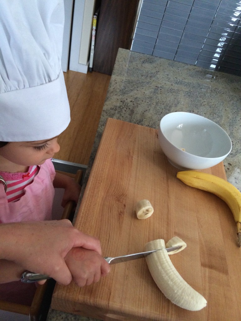 Eliana helped chop the raw bananas. A lefty (me) teaching a righty (Eliana) how to cut was interesting.