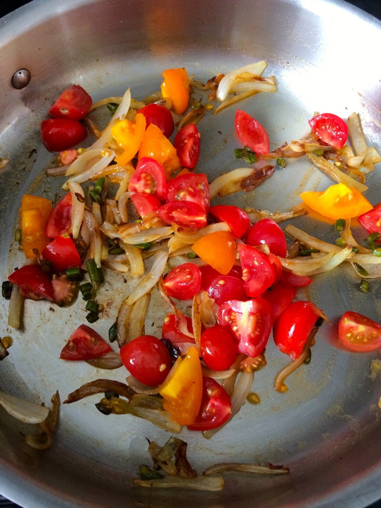 Tomatoes, scape and onions sauteeing for Yellow Squash and Tarragon Purée Pasta from teeny tiny foodie