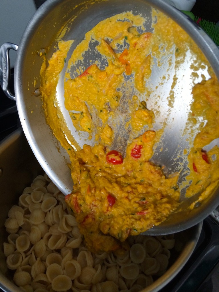 Pouring the sauce over the pasta for  Yellow Squash and Tarragon Purée Pasta from teeny tiny foodie (pretty challenging with one hand in order to take the photo, too!)