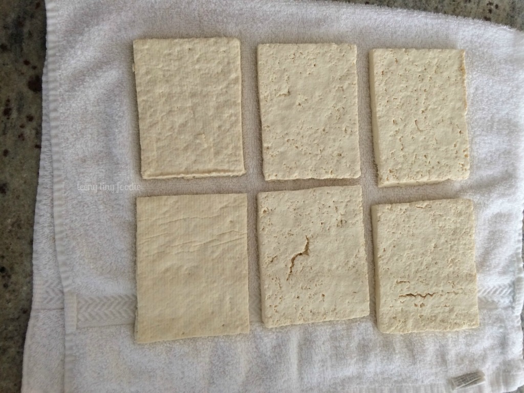 Tofu rectangles ready for pressing from Cracker Jack Quinoa from teeny tiny foodie